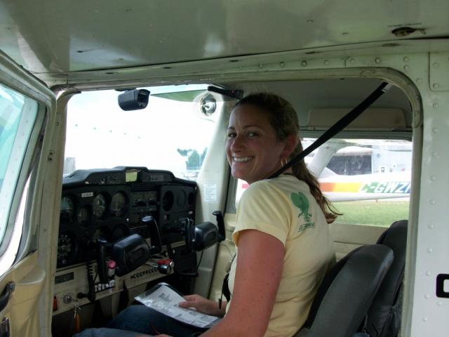 Laurie Anne Smith doing final shut down check after first solo: Relieved but happy smile after first solo...